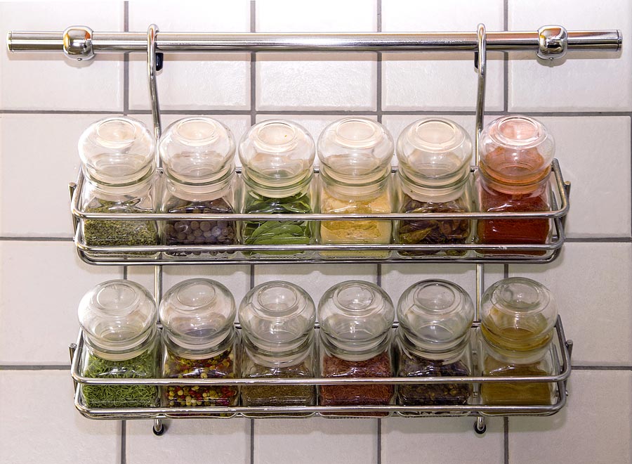 spice jars on a hanging spice rack for space saving ideas